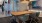 a work room with a table and chairs