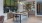 a kitchen with a bar and chairs
